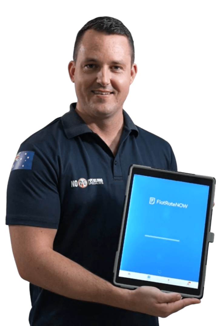 Tradie holding tablet displaying FlatRateNOW app